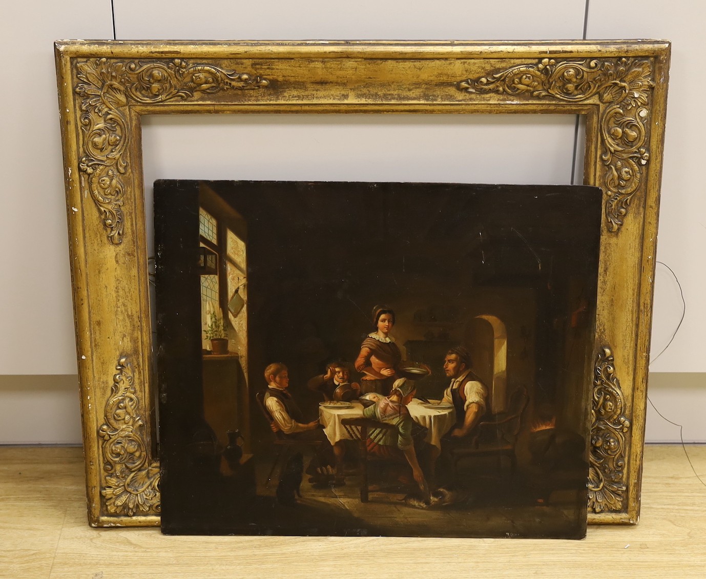 19th century German School, oil on zinc panel, Interior with family around a table, 42 x 49.5cm